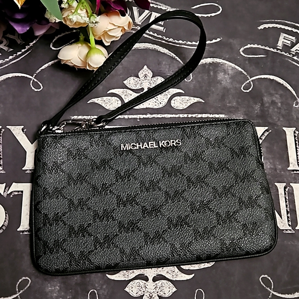 Michael Kors Wristlet with Silver Hardware.